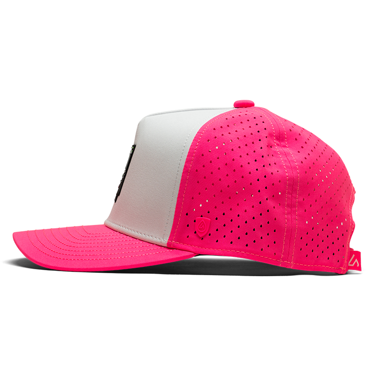 Pink and white baseball cap with perforated design on a white background