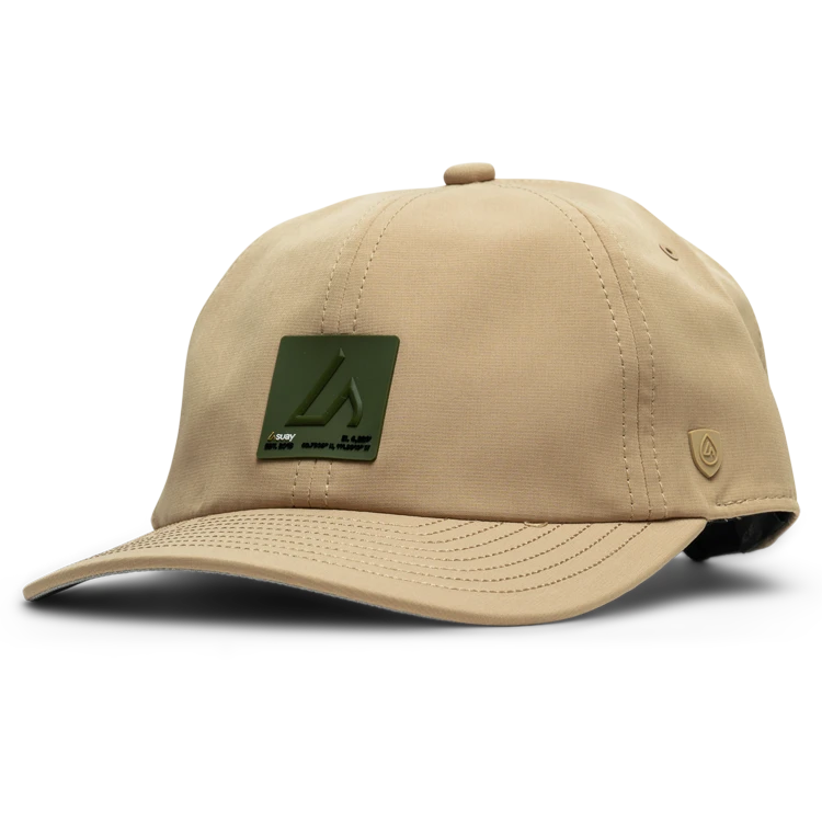 Suay hat resting on a golf bag outdoors, beading light moisture on the surface